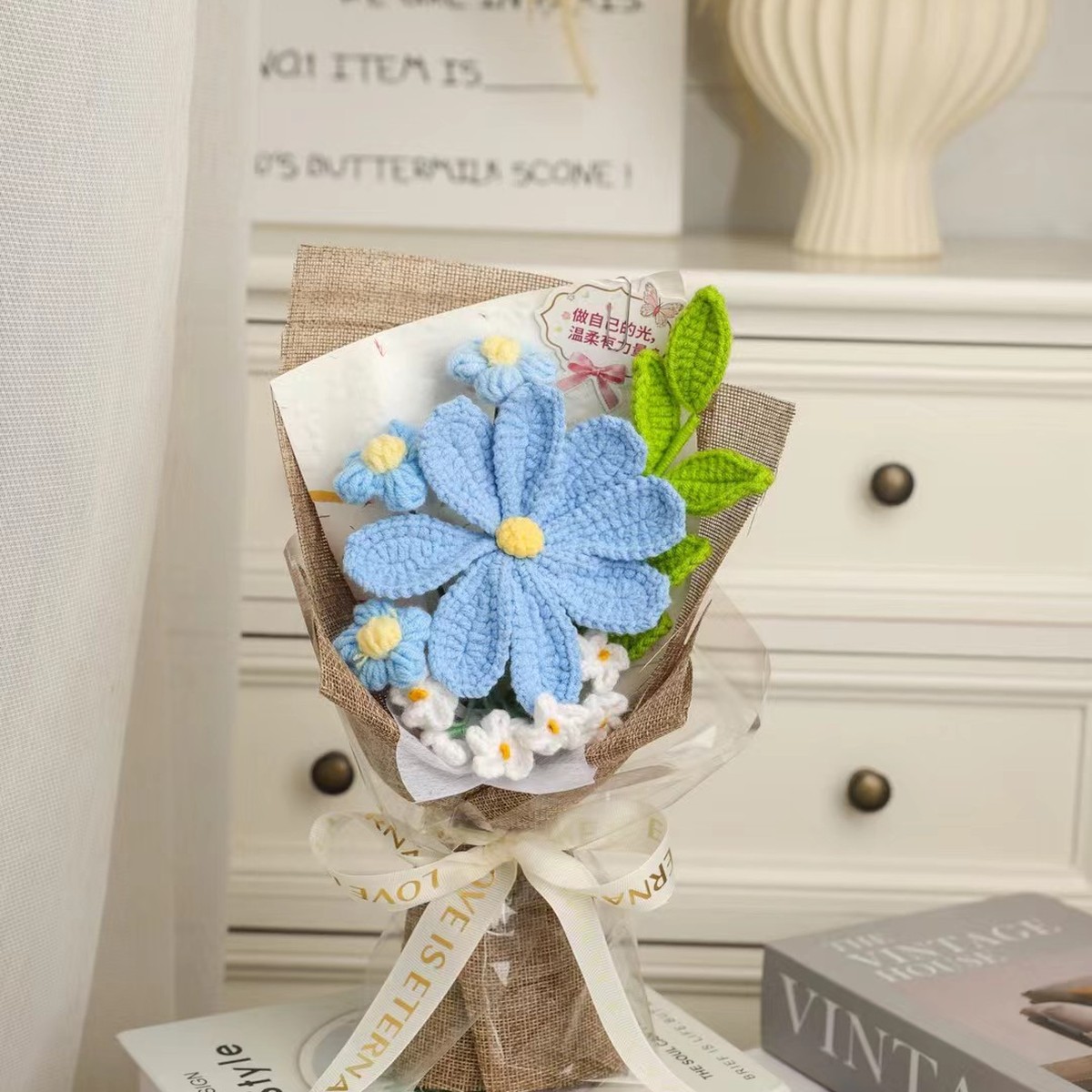 Blue Daisy Mini Crochet Bouquet centered in a clean lifestyle product photograph