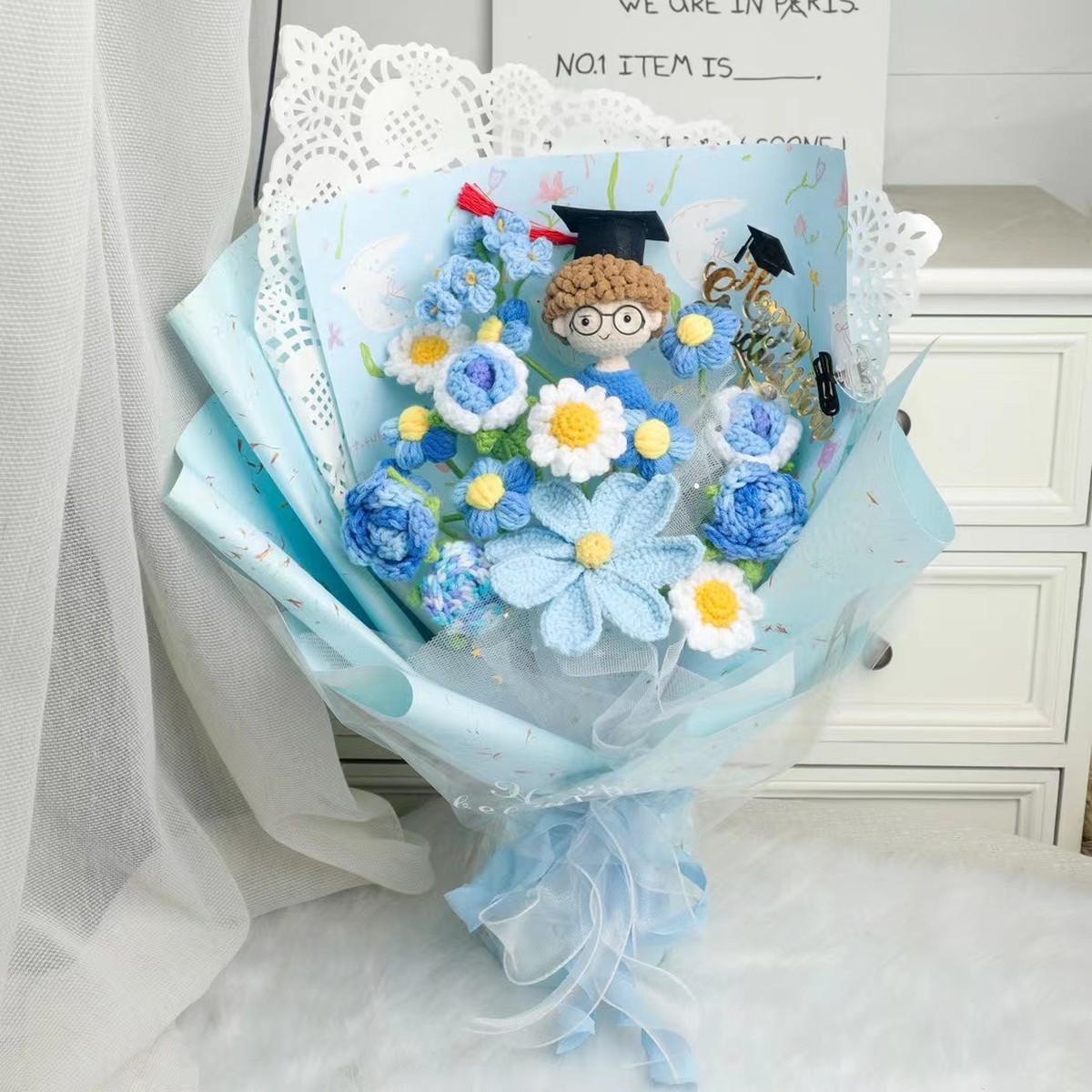 Blue Graduation Crochet Flower Bouquet centered in a clean lifestyle product photograph