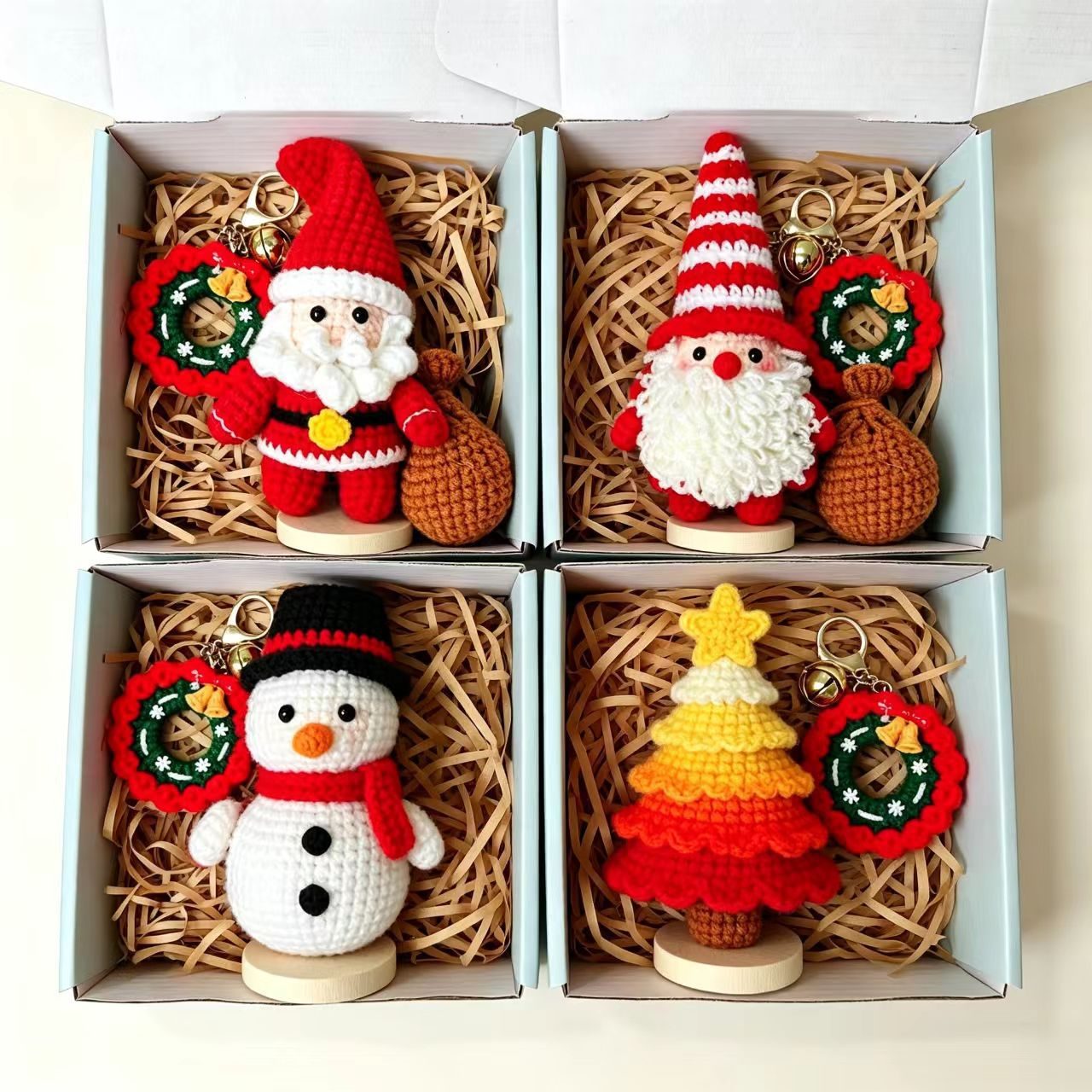 Assorted Christmas crochet decorations presented in individual kraft gift boxes