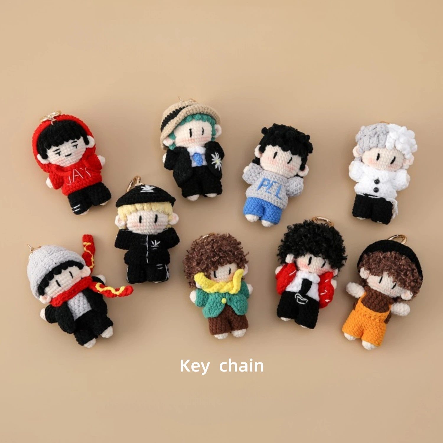 Assorted mini crochet fashion doll keychains in multiple outfits and colors