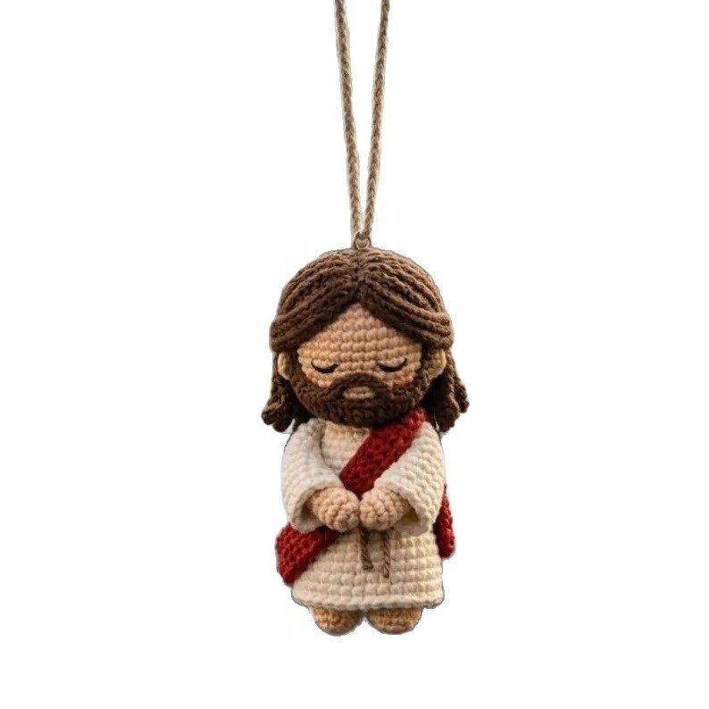 Small handmade Jesus crochet ornament hanging from a cord