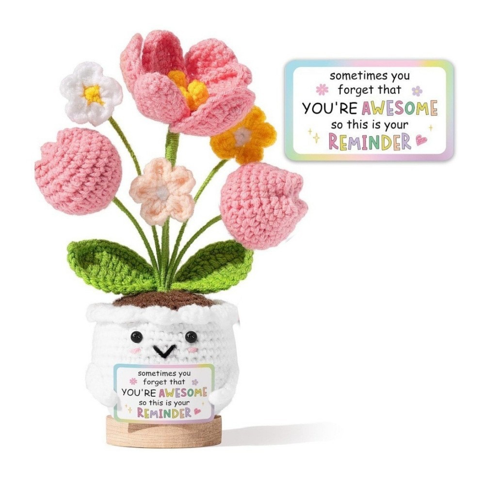 Crochet flower pot holding an encouraging positive reminder card