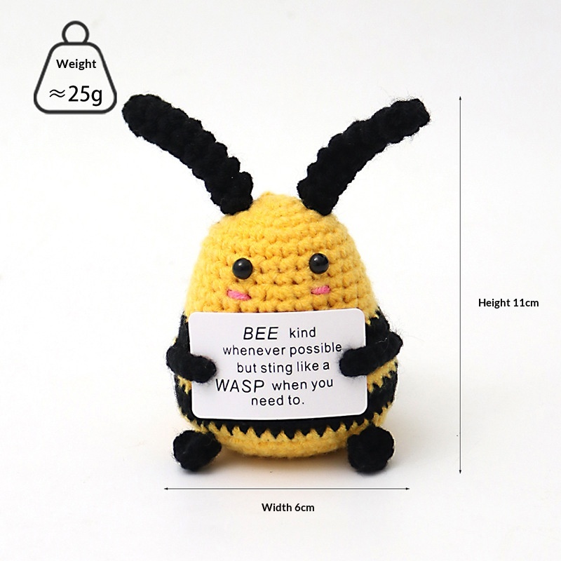 Small bee positive crochet companion holding an encouraging message card