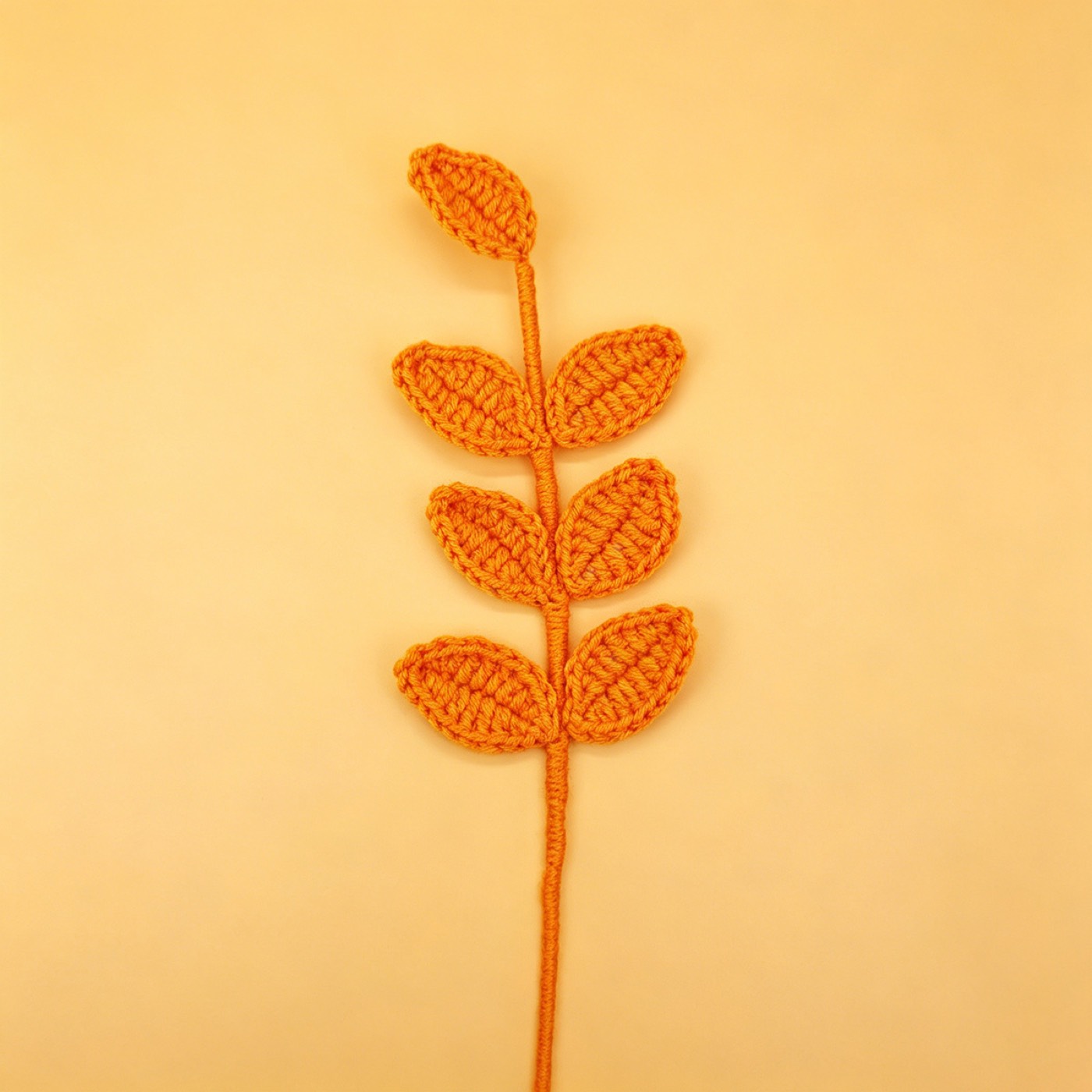 Four-Leaf Clover Crochet Stem on a clean pastel product background