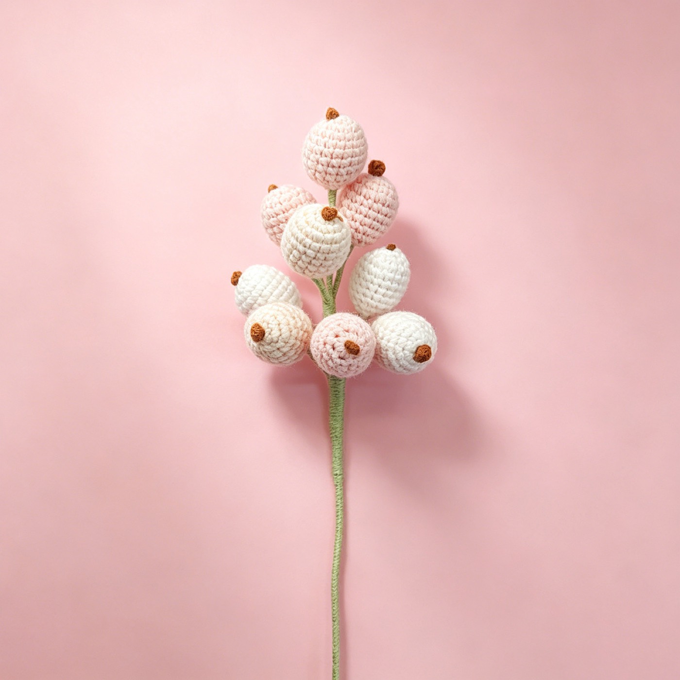 Snowberry Crochet Stem on a clean pastel product background